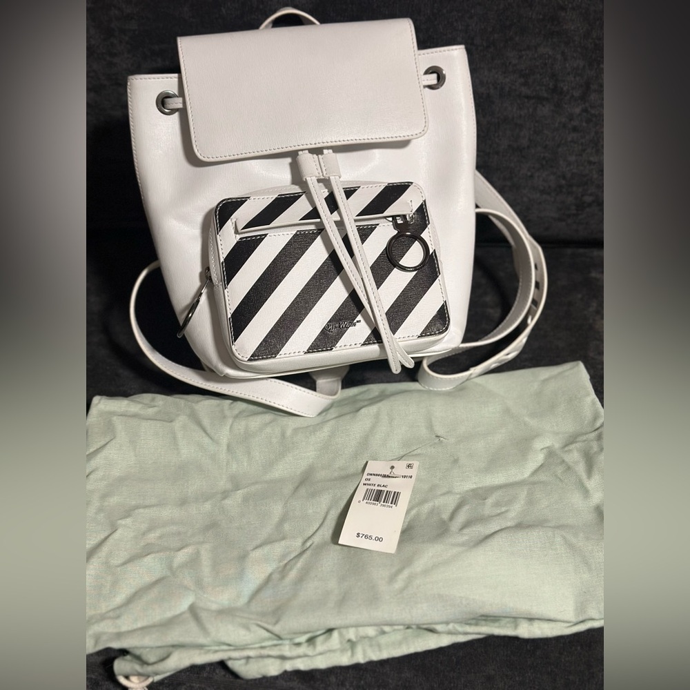 Off-white backpack, new condition - held twice.